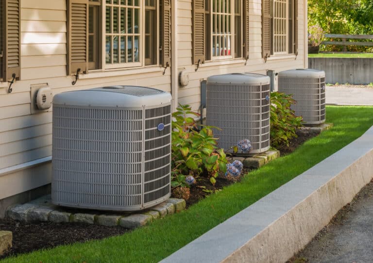Professional HVAC team performing step-by-step heat pump repair on residential system in Pasadena