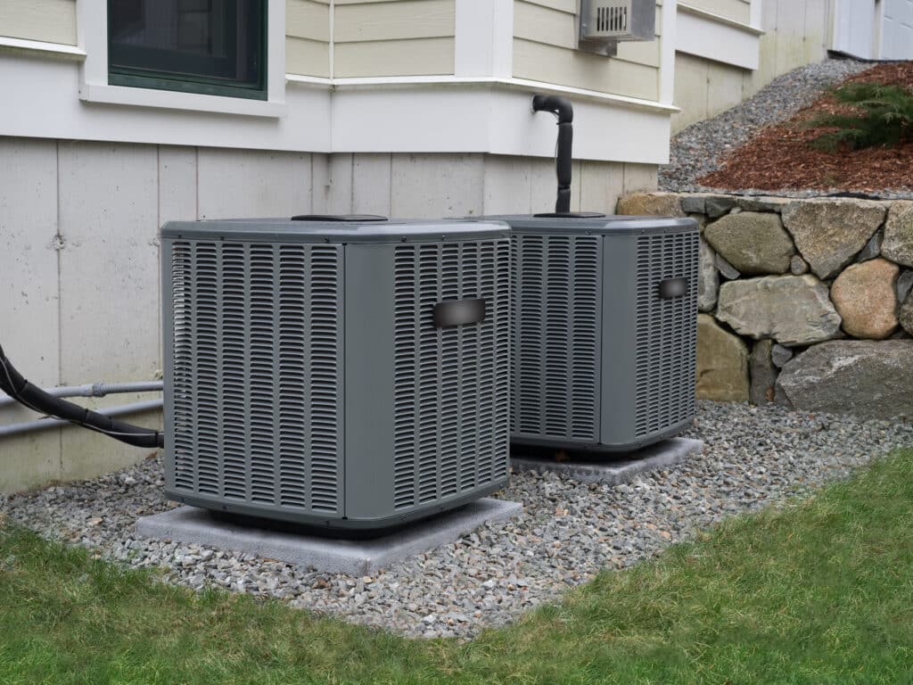 Modern high efficiency HVAC unit on a classic Pasadena bungalow under a clear blue sky Homeowner reviewing a financed AC replacement in Monrovia